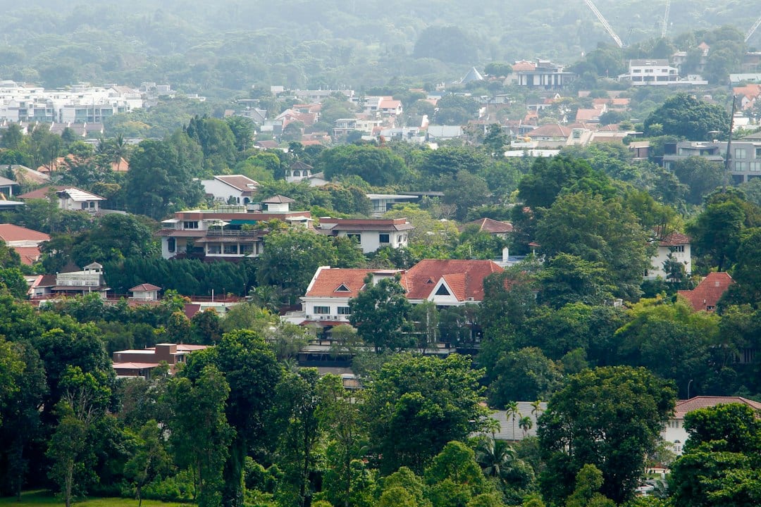 Group of landed homes in a wooded District 16 setting reminiscent of Kew
